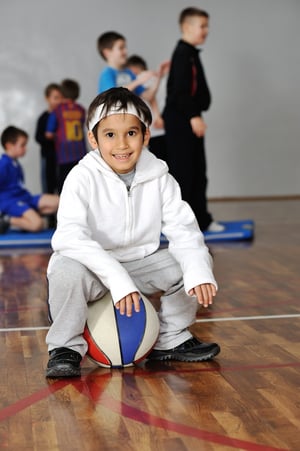 Young child enjoying basketball